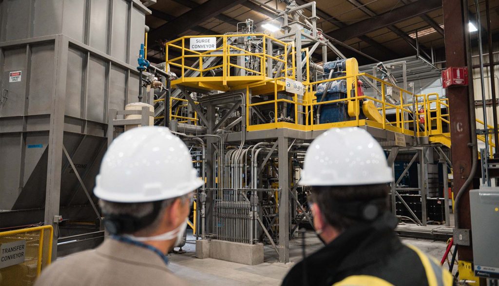 Agilyx employees working in a plastic chemical recycling facility in Tigard, Oregon.