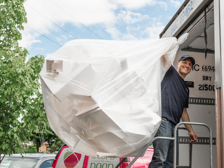 Cyclyx employee carrying post-use polystyrene waste