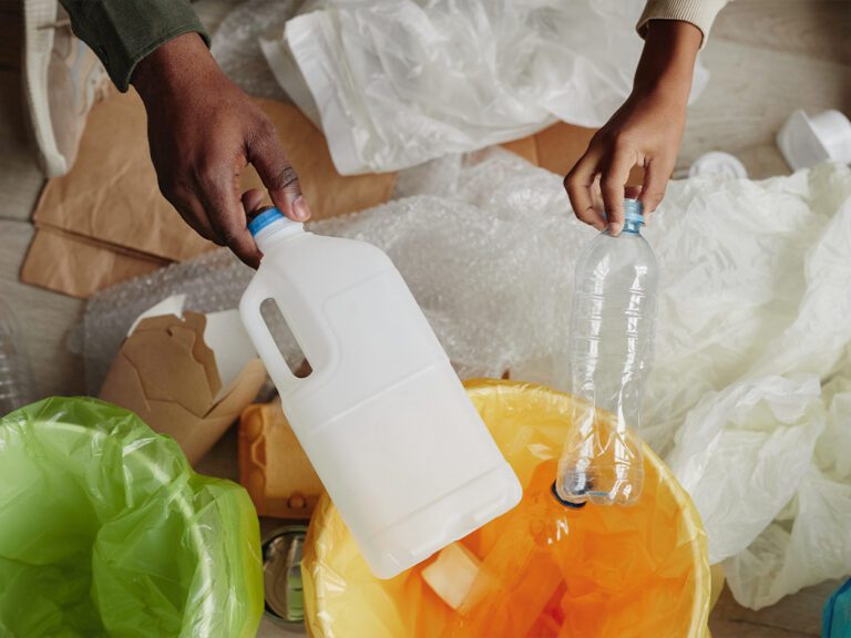 People holding plastic waste.